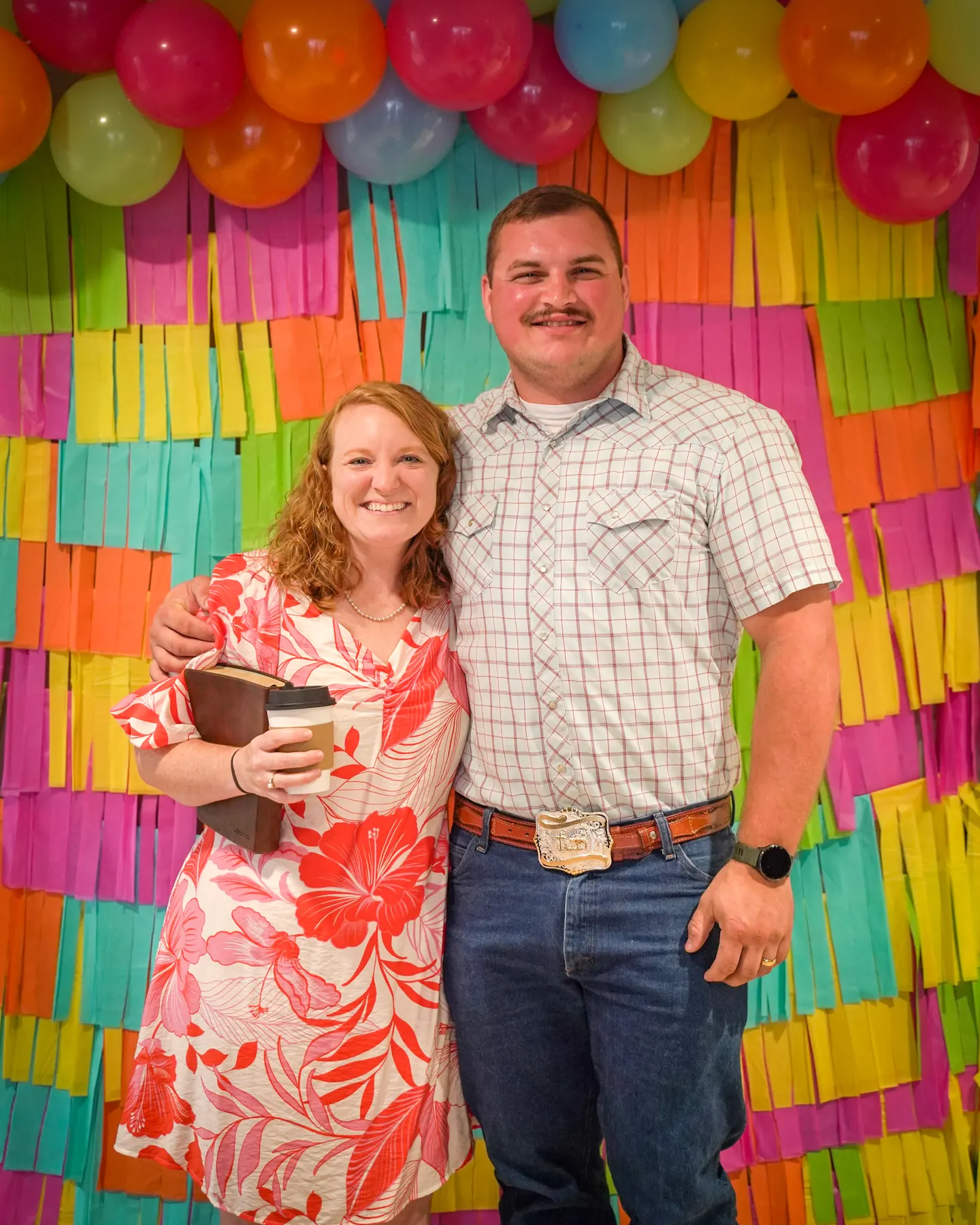 A couple in front of the fringe wall