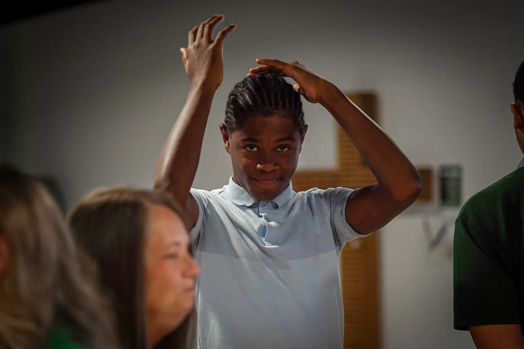 A girl with her hands raised