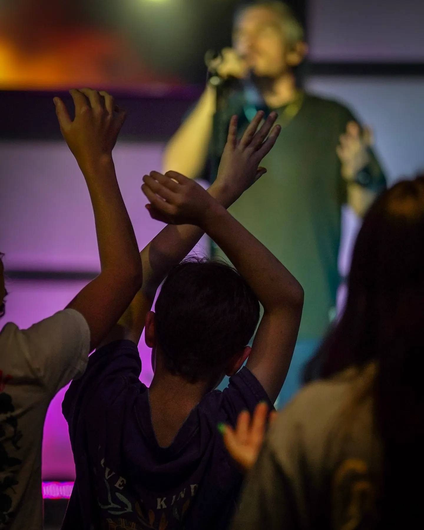 Students with their hands raised