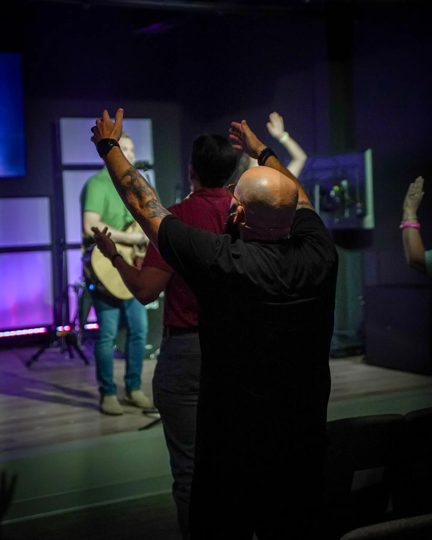 Hands raised during a song