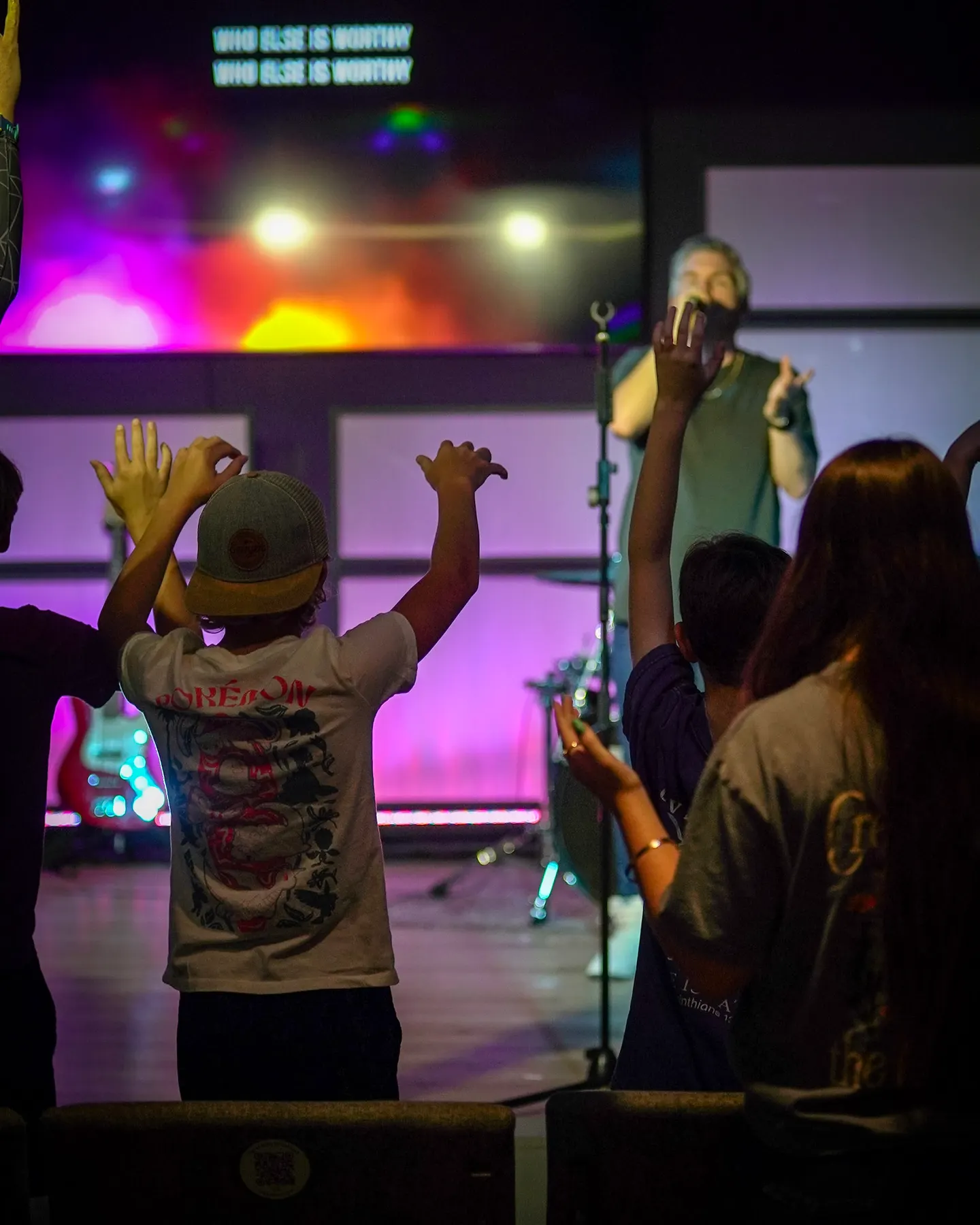 Students worshipping on a Wednesday night